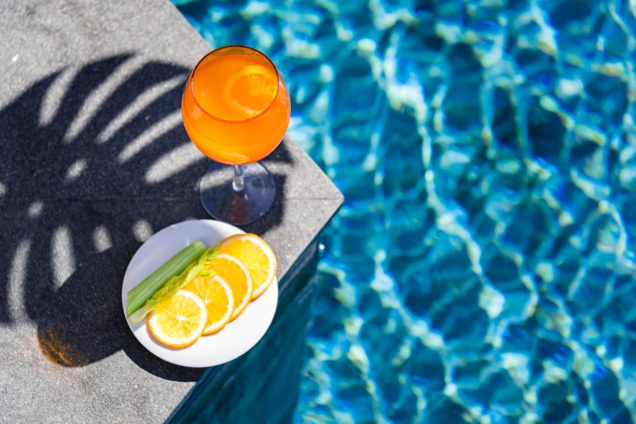 Oceanfront Beach Resort - Sha Extra Plus Patong المظهر الخارجي الصورة A glass of Aperol Spritz